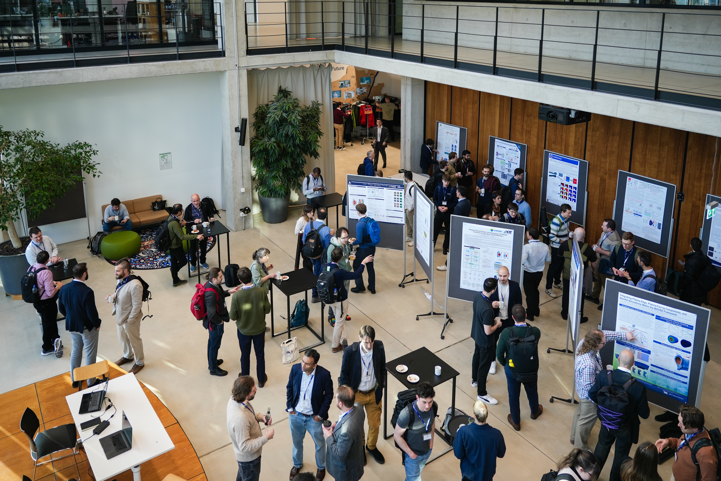 Attendees networking among research posters at OSSFE 2026